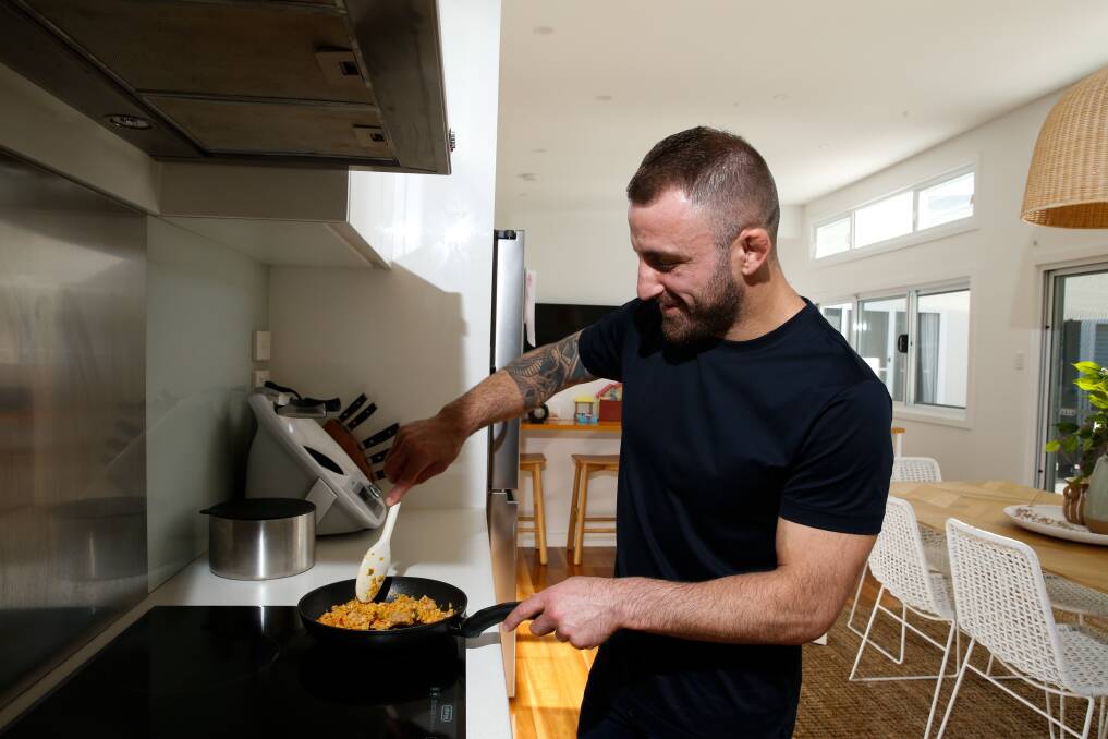 Alex Volkanovski, pictured at home in Windang, says cooking is an activity you can enjoy during lockdown. Photo: Anna Warr 