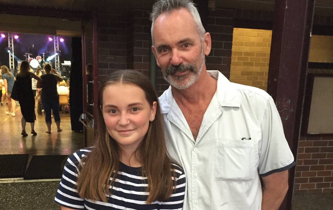 Young performer Susie Livermore with father Les Livermore at the Nowra High MADD music night.