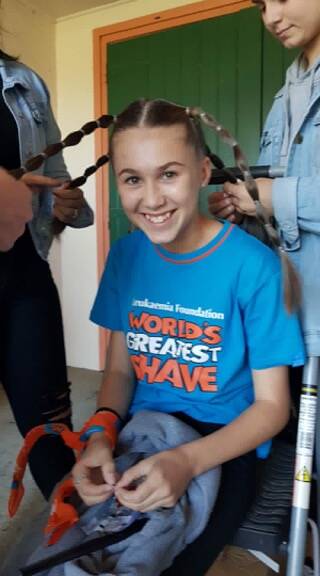 Tlia smashes Shave for a Cure goal