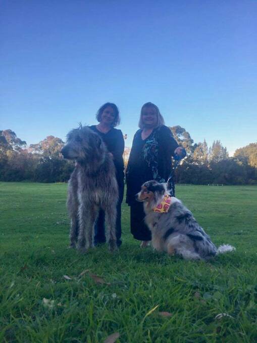 DOGS JUST WANNA HAVE FUN: Kylie Knight, of Bomaderry Community Inc, with Councillor Patricia White and dogs Fergus and River at the proposed dog park site,