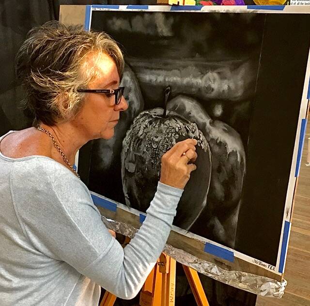 DYNAMIC: Pastel artist Jane Wray at work. Her exhibition 'Frolic' can be seen at the Old Fire Station in Kiama until Wednesday October 7. Image supplied.