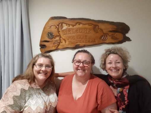 BIG SMILES: Sandra Biggs (centre) with fellow visitors at the Kiama Lions Carers Cottage Donna and Natusha. 
