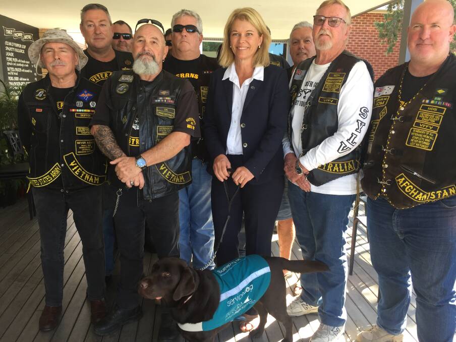 Veterans Motorcycle Club members with Nationals candidate for Gilmore, Katrina Hodgkinson, and service dog mocha.