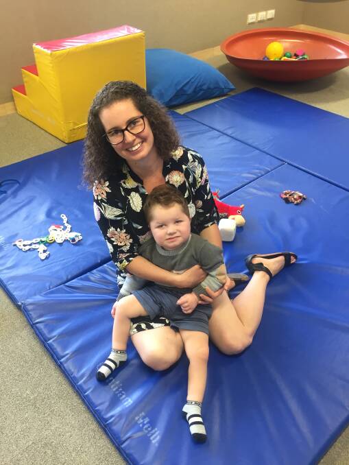 FAVOURITE PLACE: Two-year-old Murray Rodgers with his mum, Julia, at Noahs for an occupational therapy session. Murray has a life-limiting genetic condition, and at Noahs he gets to enjoy his favourite activities, such as socialising.