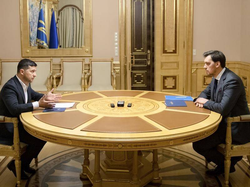 Ukrainian President Volodymyr Zelenskiy (L) has decided to give his prime minister another chance.
