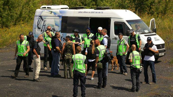 Identification of remains begins: Australian police leave the crash search sites. Photo: Kate Geraghty