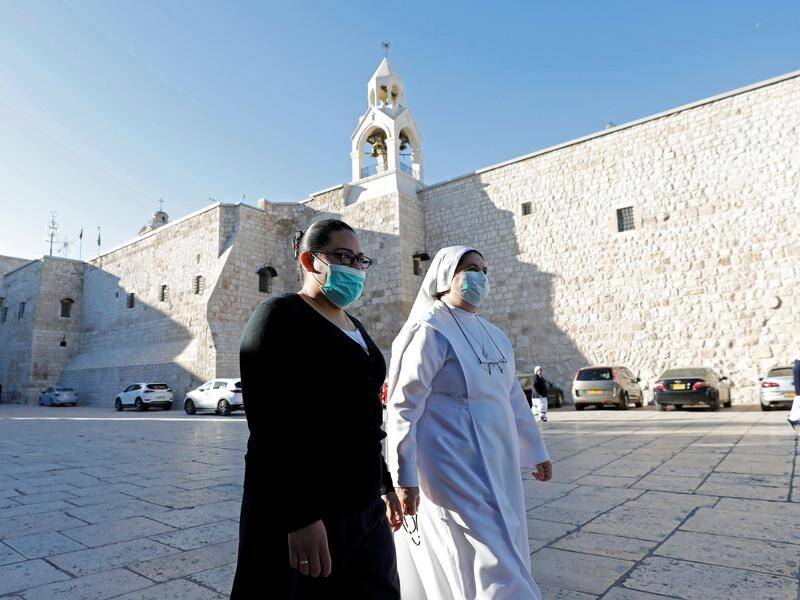 The Church of the Nativity in Bethlehem has reopened after Palestinians eased their virus lockdown.
