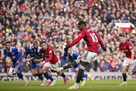 Manchester United's Marcus Rashford scores from the penalty spot in the win over Everton. (AP PHOTO)