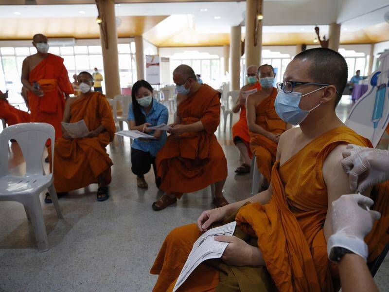Thai Buddhist monks receive vaccine jabs at a Buddhist temple in Bangkok.
