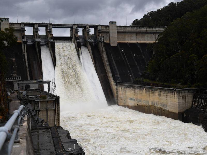 Just as it did in 2021, Sydney's Warragamba Dam has reached capacity after record rains. (Dan Himbrechts/AAP PHOTOS)