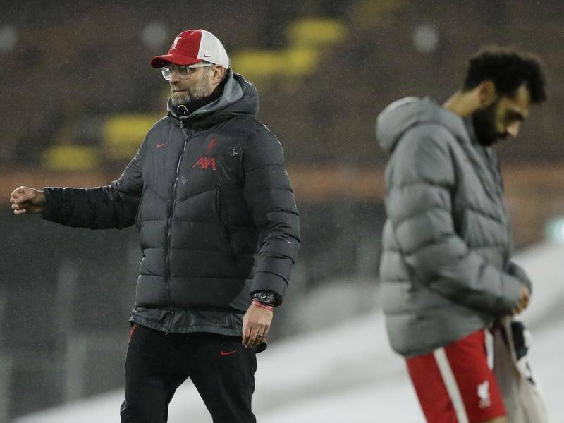 Juergen Klopp says Mohamed Salah is happy at Liverpool despite speculation to the contrary.