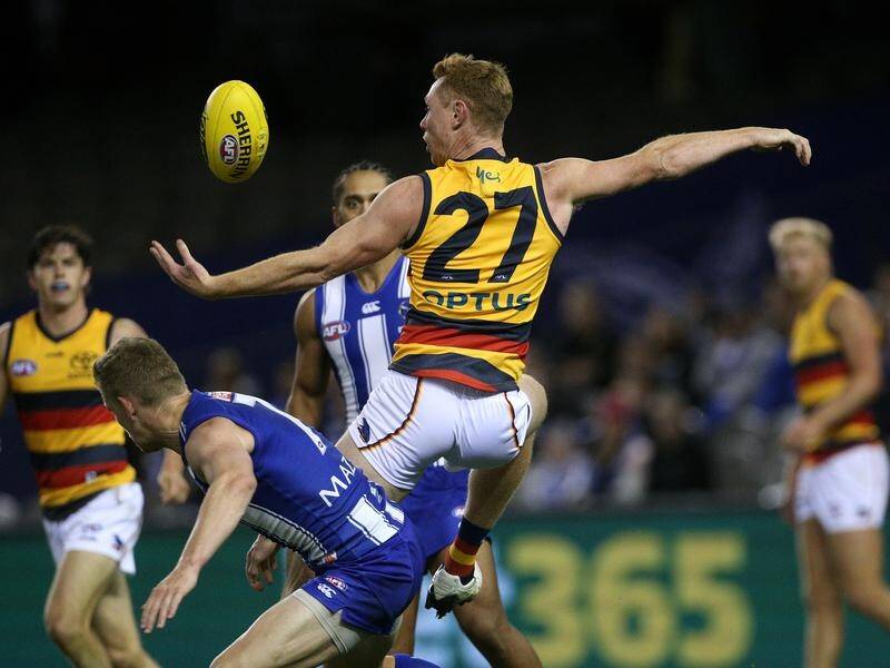 Adelaide crushed North Melbourne with eight goals in the final quarter of their AFL clash.