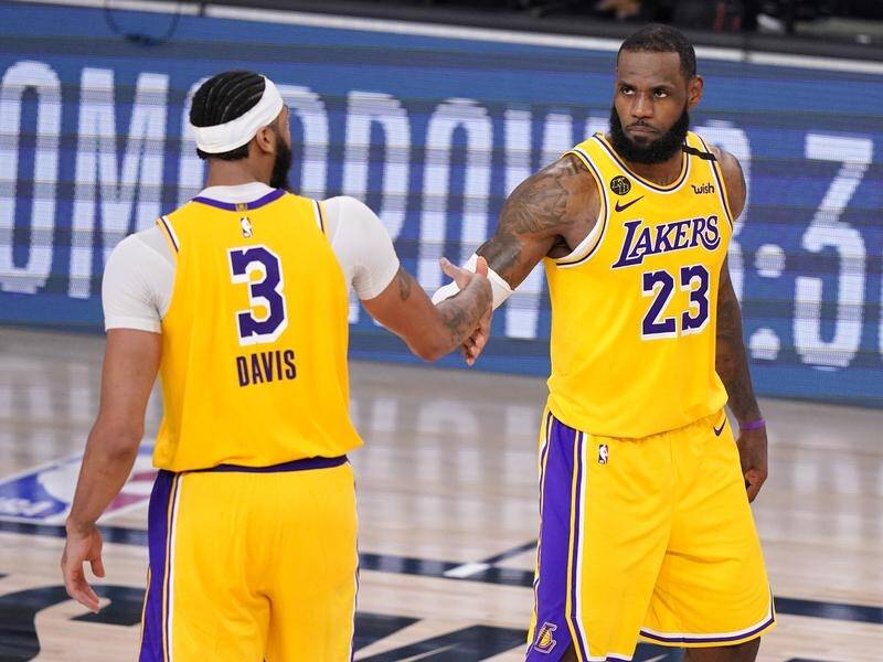 LA Lakers' Anthony Davis and LeBron James combined for 60 points in their NBA win over Denver.