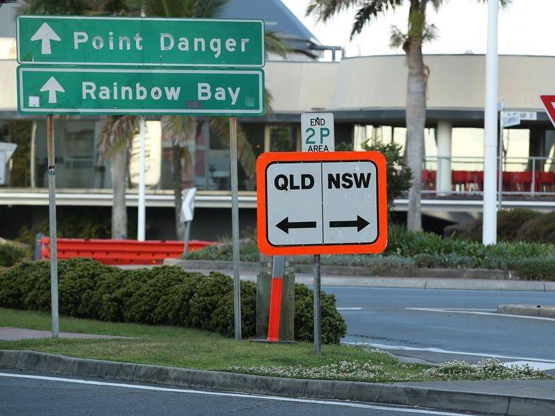 A Queensland police officer has been charged after allegedly helping his daughter cross from NSW.