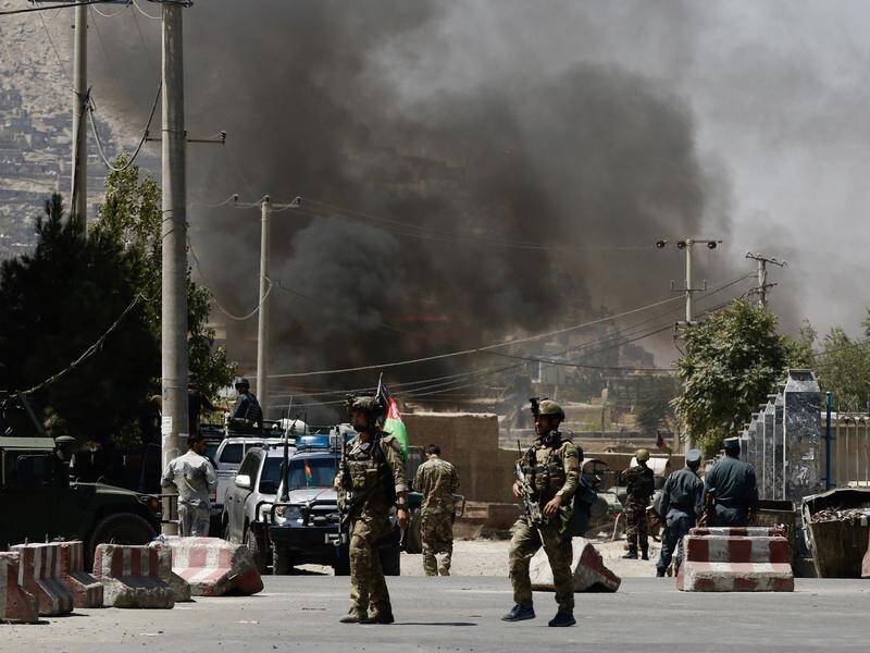 Rockets fired during a speech by the Afghan president prompted a fierce response by security forces.