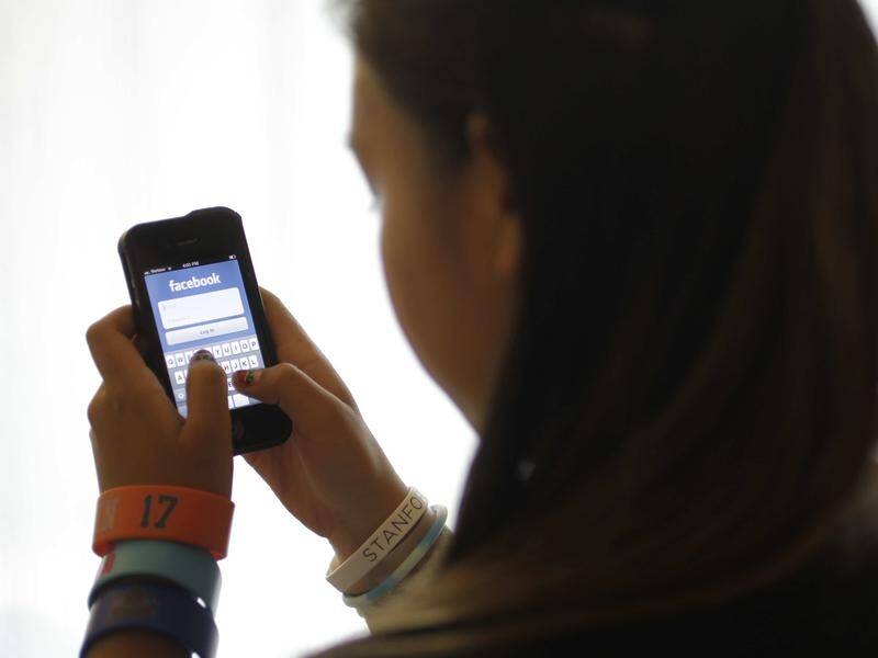 Facebook is making it safer for children and teens to use the app by tightening privacy settings. (AP PHOTO)