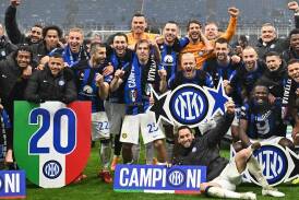 Inter celebrate winning their 20th Serie A title on a rain-sodden night at San Siro. (EPA PHOTO)