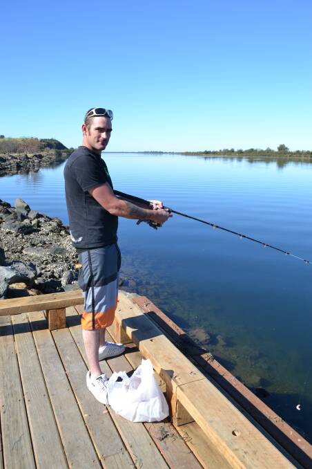 KEEN ANGLER: Recreational fisherman Jeremy Vanhelden tries out the new fishing platform that is proving very popular with locals.