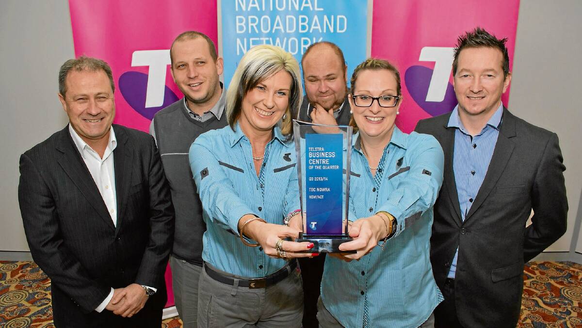 WINNERS ARE GRINNERS: Nowra Telstra Business Centre staff Adam Dymond, David Southam, Nicole Francis, Boyd Bonett, Sheridan Dunphy and Dave Gaze with their trophy after being named the best Telstra Business Centre in NSW and the ACT.
