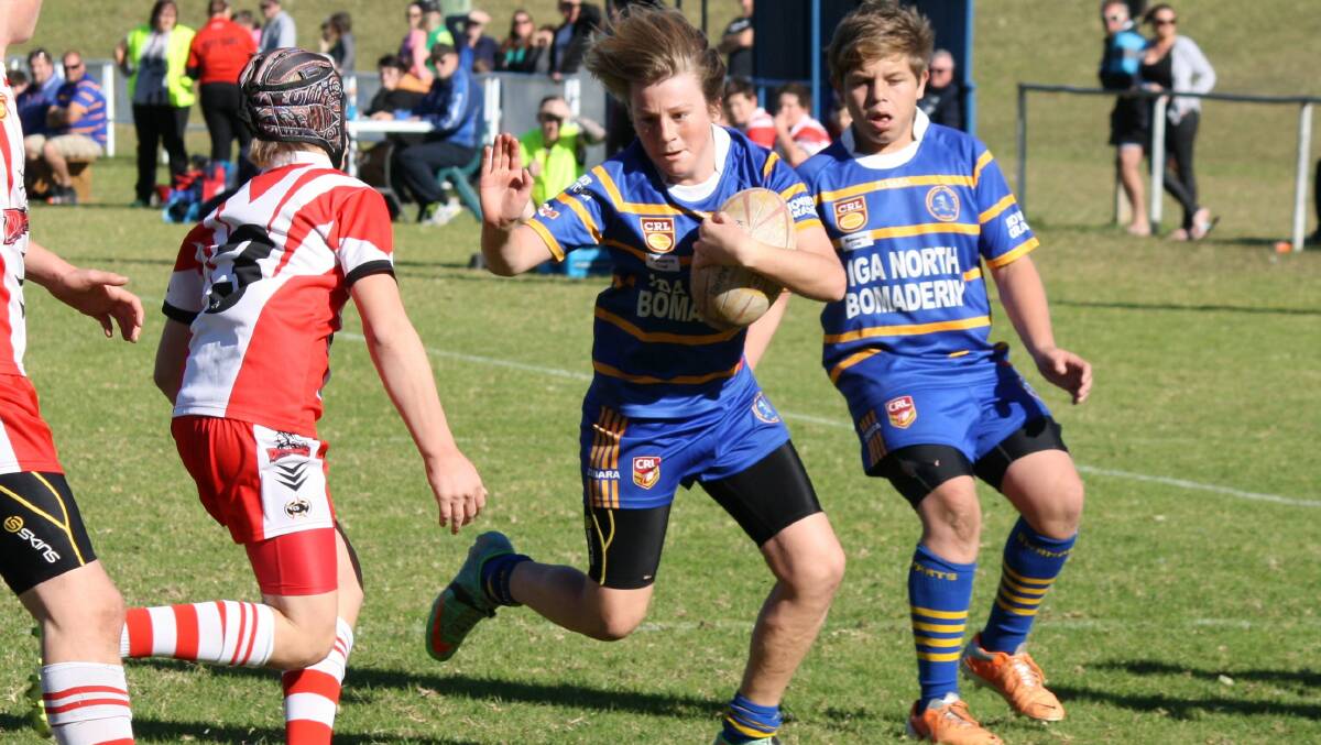 POWER THROUGH: Bomaderry u13 player Ky Sims is on his way to score a try in his side’s 44-26 win over St Georges Basin last week.  