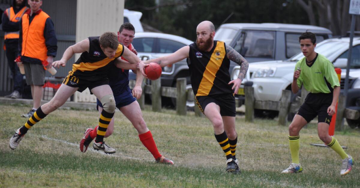 CLOSE CALL: Bomaderry Tigers’ Joshua Smith manages to keep the ball from going out of play. Photos: GILLIAN LETT