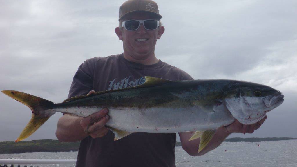 KING OF THE WATER: Lachlan Gubb displays an average sized kingfish from the local waters. 