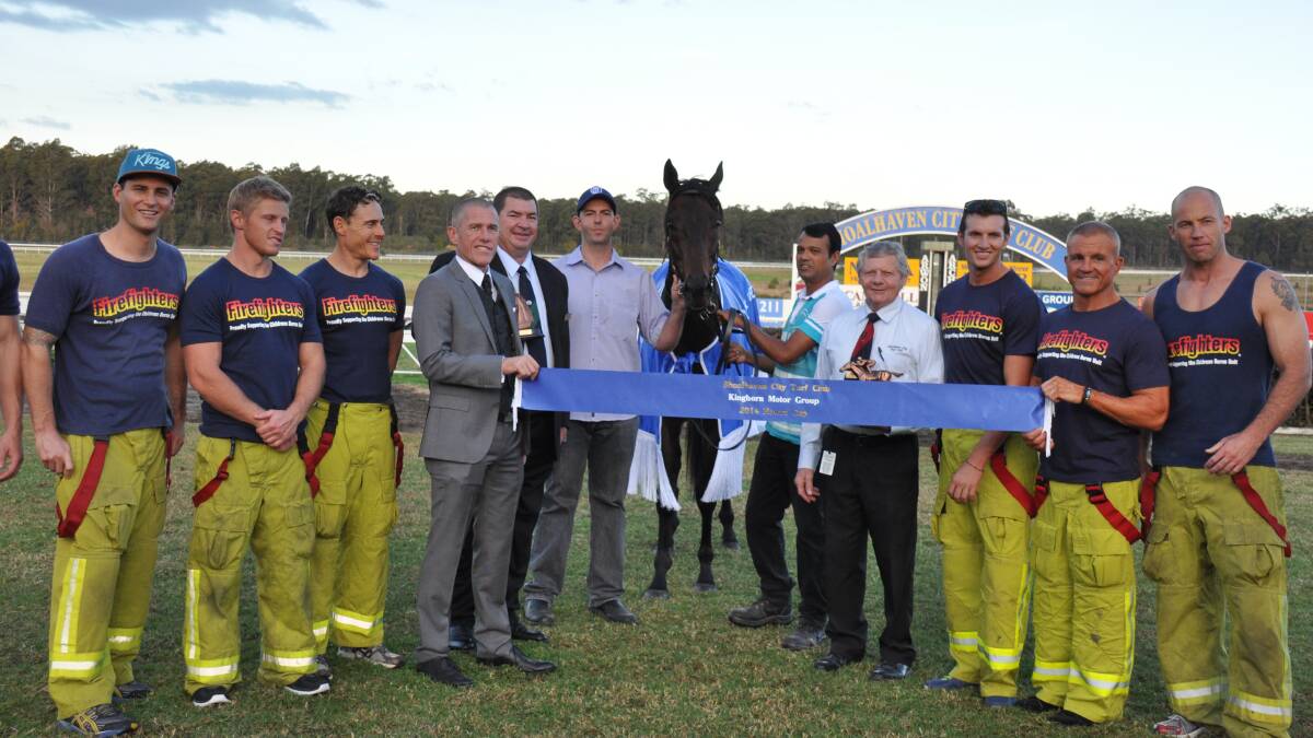 WINNING CIRCLE: The men of the 2015 NSW Firefighters Calendar celebrate Genki Moochi’s win in the 2014 Nowra Cup with Kinghorn Motor Group owner Geoff O’Connell, Shoalhaven City Turf Club chairman Mike Martin, trainer Jason Coyle and Shoalhaven City Turf Club vice-chairman Ian Whitby.  