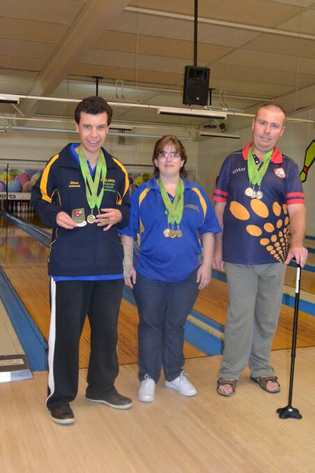 SUCCESS: Glenn Corbett, Cara Cooper and Adam Richardson show off their medals won in Moonah, Tasmania. 