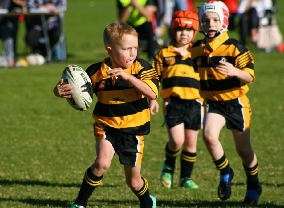 HOP THROUGH THE GAP: Nowra Warriors u8 Kangaroo player Michael Brown looks for a gap during his round 10 match against St Georges Basin. 
