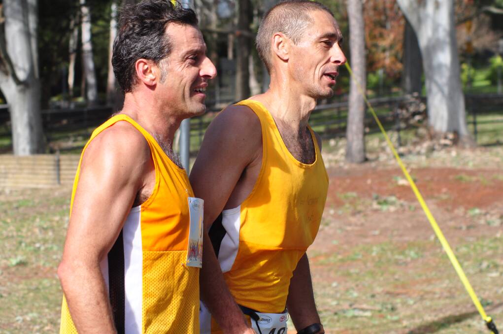 MATES: Nowra Athletics Club members Leith Babian and Damian Smith after the Shoalhaven King of the Mountain on Sunday. 