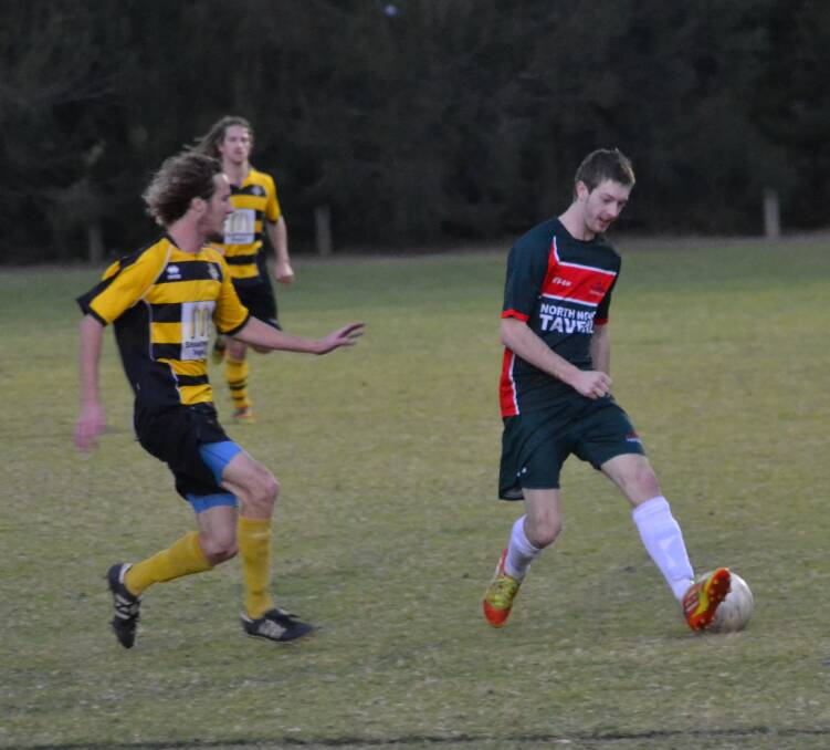 REDEMPTION: Bomaderry’s Mitch Cornell keeps an eye on Brendan Thorpe from Illaroo during their 4-nil win on Saturday. Photo: PATRICK FAHY 