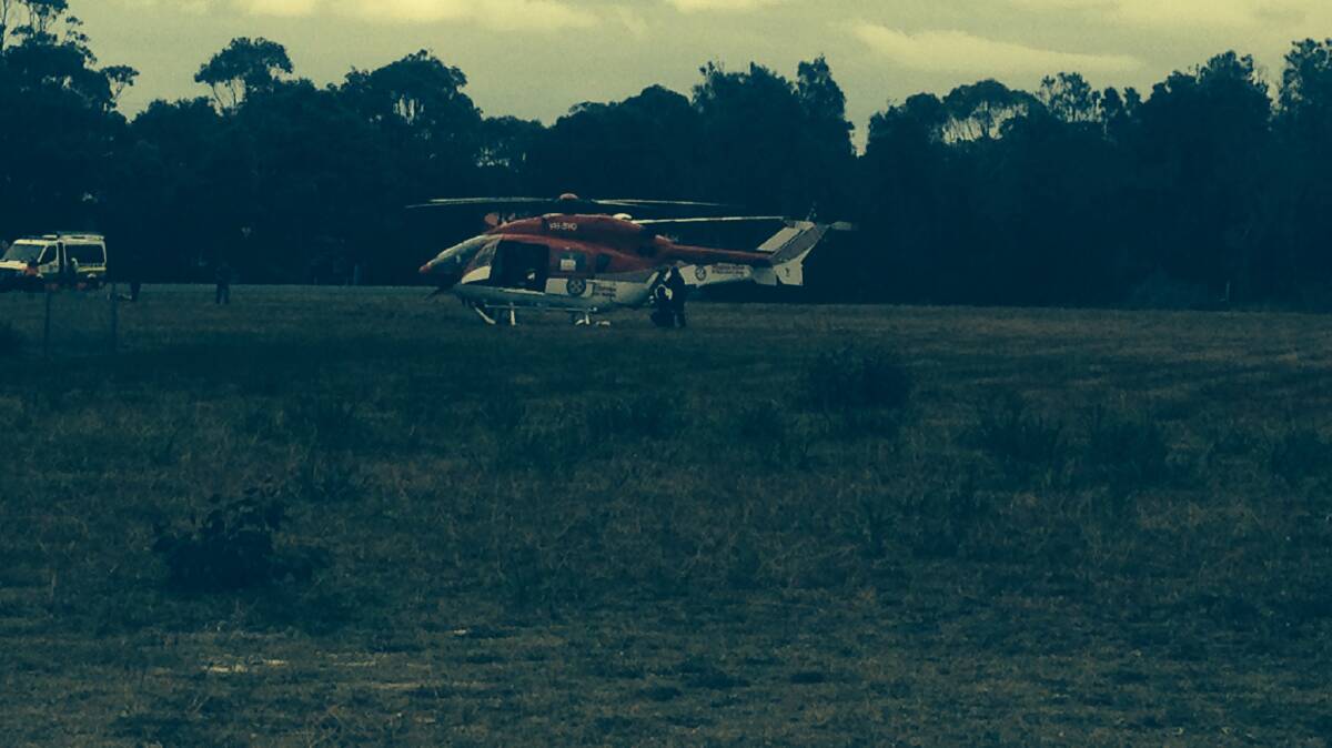 Ambulance Rescue helicopters await the arrival of casualties from Saturdays's double fatality on Culburra Road.