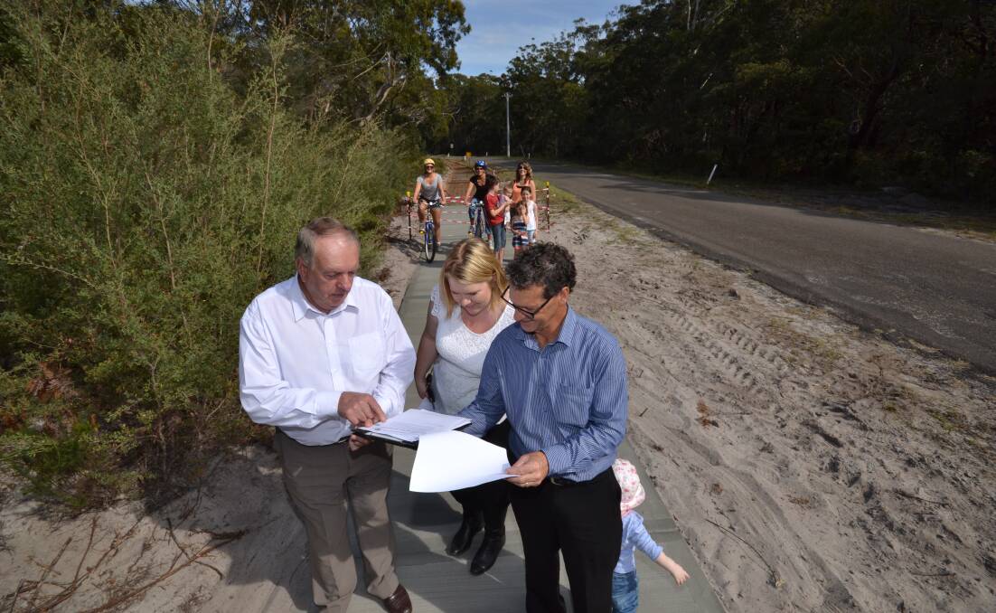 Shoalhaven councillors Greg Watson and Jemma Tribe take a look at the new shared path that will link Callala Beach with Myola with president of the Callala beach Progress Association Greg Westlake.
