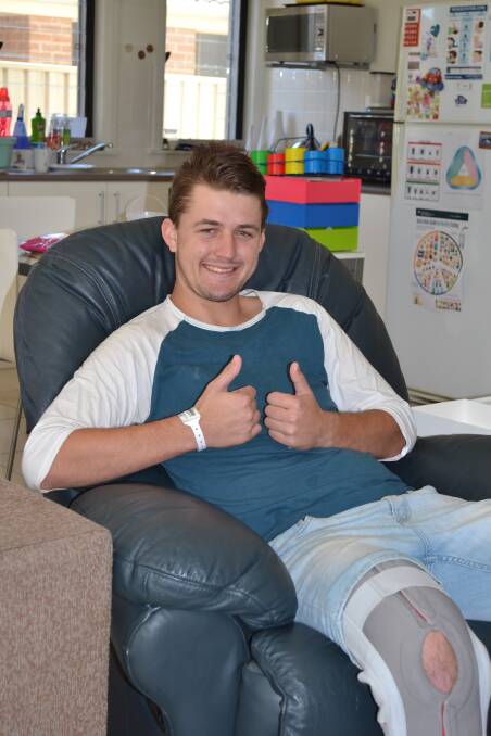 THUMBS UP:  Jordy Pearson gives the thumps up during a recent trip home as he continues his recovery from a serious neck injury. Photo: PATRICK FAHY  