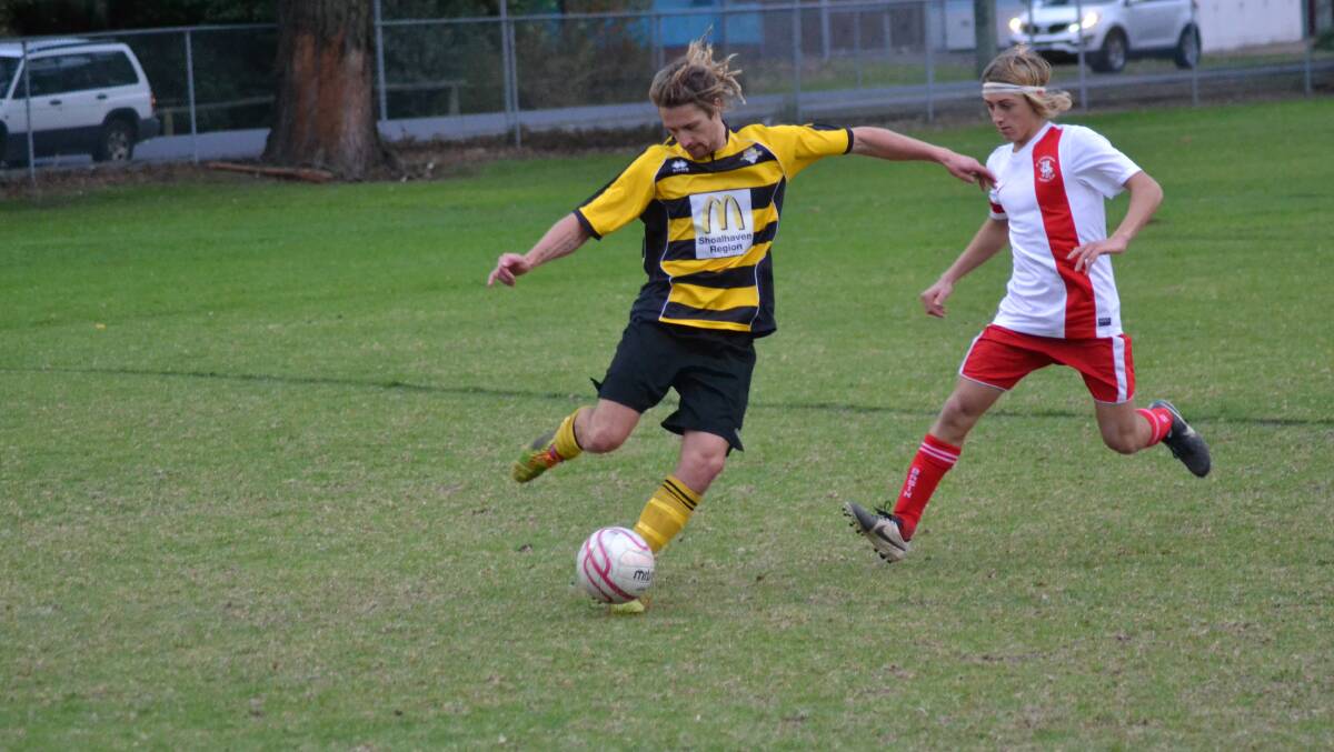 HEAD TO HEAD: Bomaderry’s Matt Roberts and St Georges Basin’s Wade Garin clash in Bomaderry’s 5-1 win on Saturday. Photo: PATRICK FAHY 