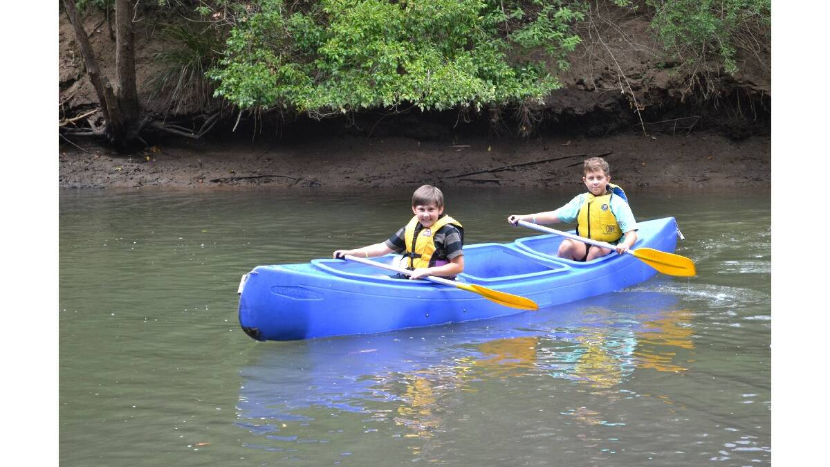 Kyan Lorber and Kye Mason-Jones from Illaroo Scouts are all smiles as they paddle their canoe at the Camp of Guides and Scouts at Bangalee Scout Camp on Saturday.