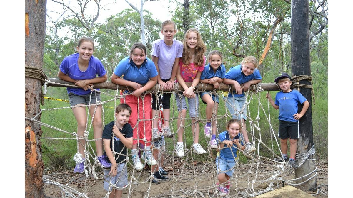 Sophie Dobell, Thomas Dobell, Amber Hopley, Nicola Boyle, Lara Horvat, Ebony Wellman, Danyah Wellman, Emily Horvat and Riley Boyle from Sussex Inlet Guides have loads of fun on the commando course at the Combined Camp of Guides and Scouts at Bangalee Scout Camp on Saturday.