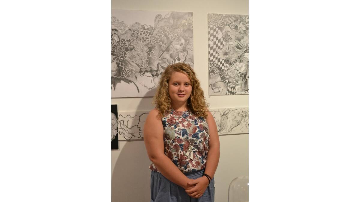 Kaysan Collins from Vincentia High School with her artwork The Exquisite Side of the Subconscious Mind at the opening of the Body Of Work: Wow! showcase at the Shoalhaven City Arts Centre on Saturday.