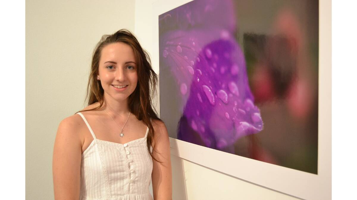 Sarah Hazell from Nowra High School with her photo series Monumental at the opening of the Body Of Work: Wow! showcase at the Shoalhaven City Arts Centre on Saturday.