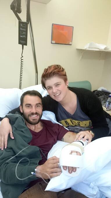 lucky man: Shoalhaven Zoo handler Trent Burton with his wife Nyssa recovering in the Sydney Hand Hospital after being bitten and dragged into the water by the zoo’s resident croc John.