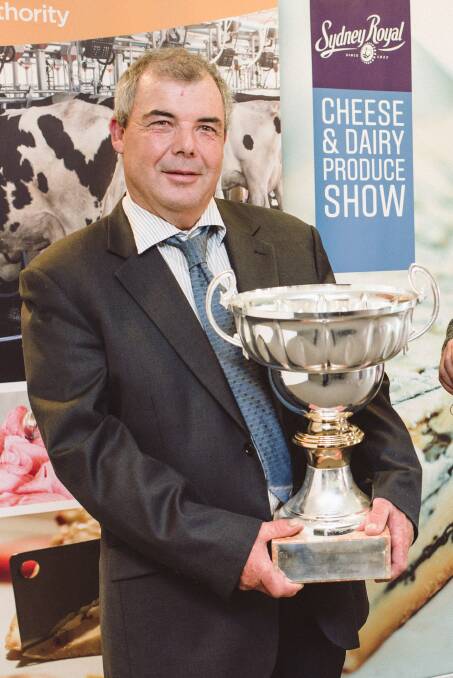 GOLD STANDARD: Berry Rural Co-operative chairman Paul Timbs shows off the Jim Forsyth Perpetual Trophy for champion milk at the Sydney Royal Show. Residents can sample South Coast Milk products for free this Saturday.