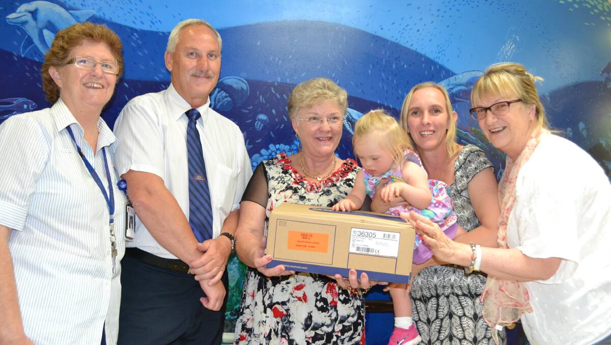 AIR TIME: North Nowra mother Judy Davies with her daughter Lilly-Rose along with Shoalhaven Ex-Servicemen’s Club assistant secretary manager Tony Waller, Pam Jenkins of Air Liquide Healthcare and Gillian Lindsey from Life Path Planner present the new ResMed S9 CPAP machine to Shoalhaven Hospital children’s ward nurse unit manager Colleen Foy (far left).