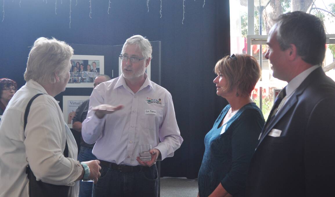 CLEAR PATH: Tim Francis from Taste of Paradise Farm explains to Gilmore MP Ann Sudmalis why he supports the Partnership Brokers program as Lynelle Johnson (Nowra partnership broker) and Craig Dadds (Partnership Brokers National Network executive officer) watch.