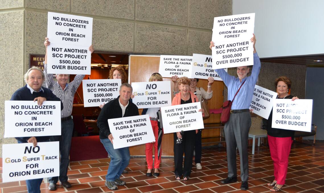 VOICING CONCERN: Peter Hands, Al Boscoscuro, David Hopkins, Adele Milton, Ros Vickery, Liana Boscoscuro, Eileen Taylor, Sandy Easterbrook and Anne King display their displeasure at council’s move to construct the Orion Beach shared pathway.
