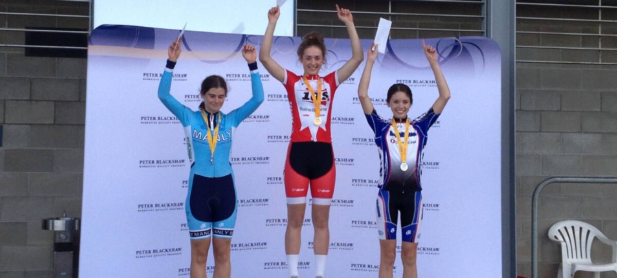 WINNERS ARE GRINNERS: Natasha Mullany (centre) celebrates winning the stage three road race.