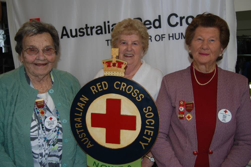 LONG SERVICE: Red Cross Nowra branch members Coralie Woolley, Dot Galley and Zena Apps rack up more than a century and a half of help. 