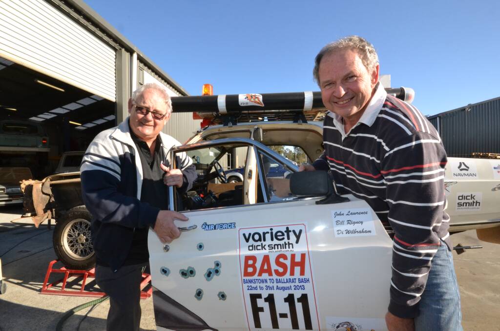 BUILDING A BOMBER: Bill Rigney and John Lawrence have a few ‘minor’ adjustments to make to their Variety Club Bash car before entering this year’s 30th anniversary event.