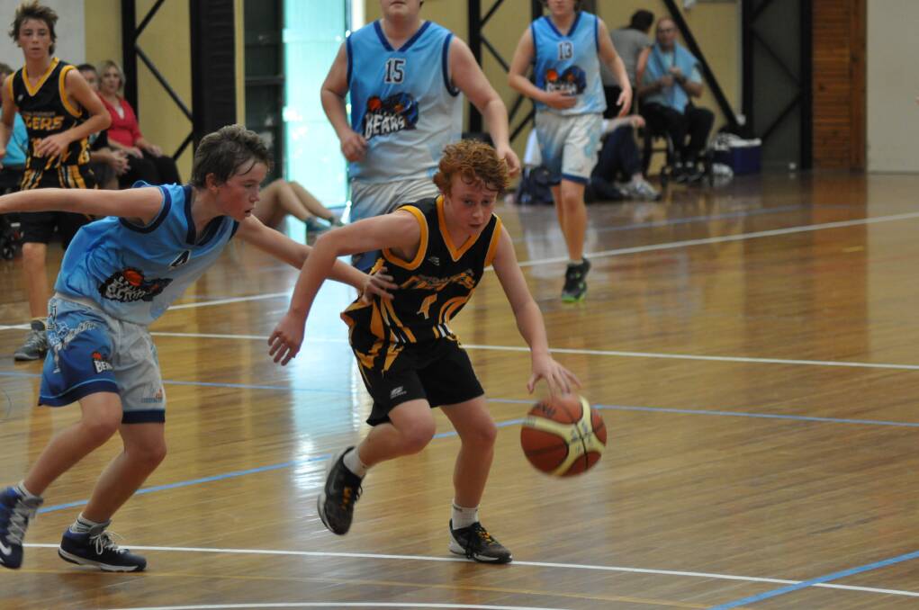 ON THE RUN: Shoalhaven under 16s player Brodie Roddam takes the ball down the court.