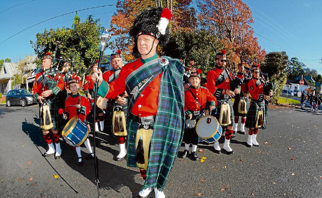 BEAT: Drum Major Mick Jenner warms up the Shoalhaven City Pipes and Drums before leading the Berry Celtic Festival street parade in 2013.