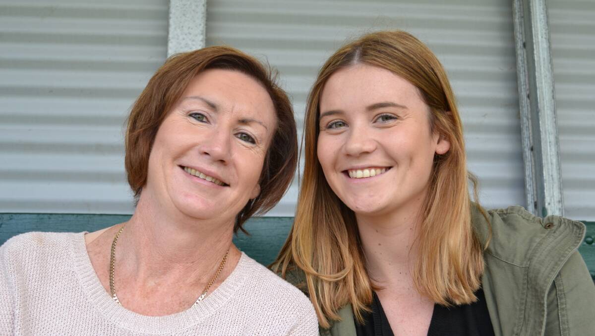 CHEERING THEIR TEAM ON TO VICTORY in the second division bout between the Vikings and Shoalies on Saturday at Shoalhaven Rugby Park are Wollongong residents Mandy Giles and Emily Anderson. 